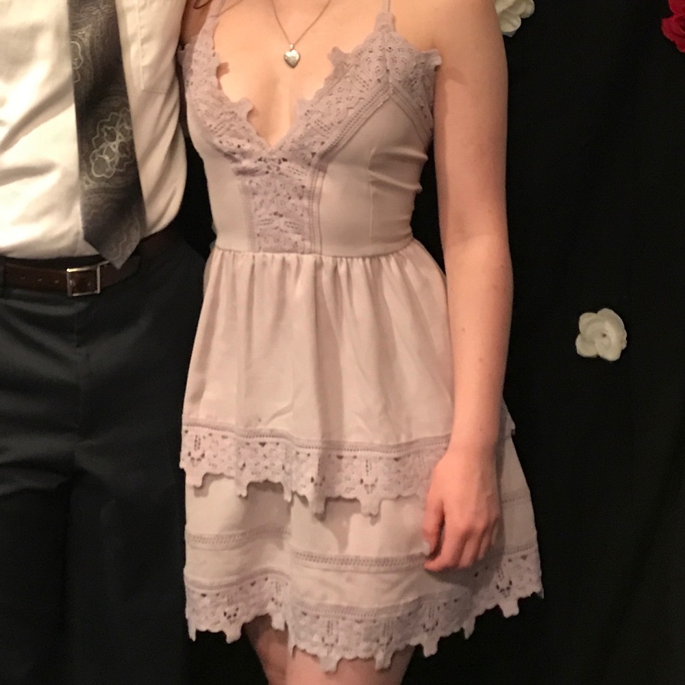 Lilac tiered dress with criss cross back.